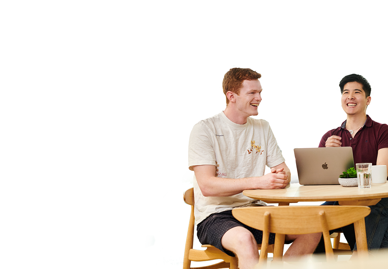 Two Deliveroo employees working together in the office