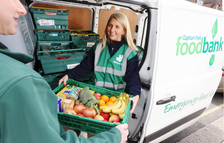 Deliveroo employee delivering groceries